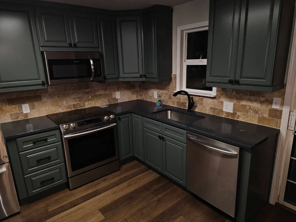 Dark Turquoise Kitchen With Black Waterfall Countertops