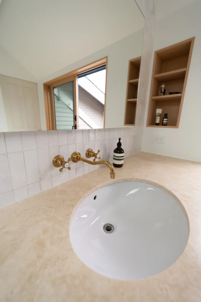 Modern Porcelain Sink With Brown countertop & thin modern bronze plated faucet