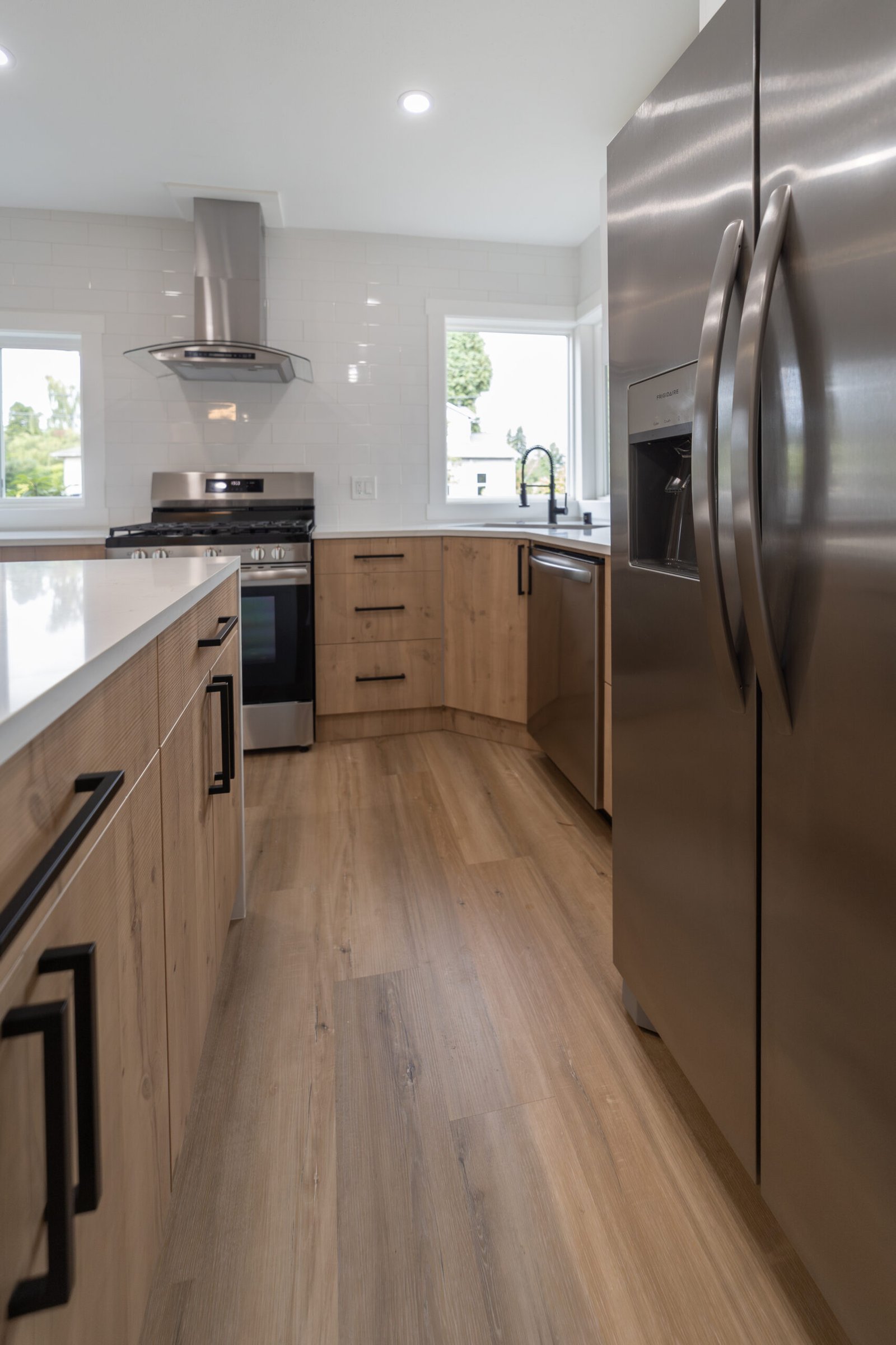 Modern Kitchen With Warm Wood And White Finishes Kitchen Remodel in Mercer Island, WA by FDC Construction project photo 2