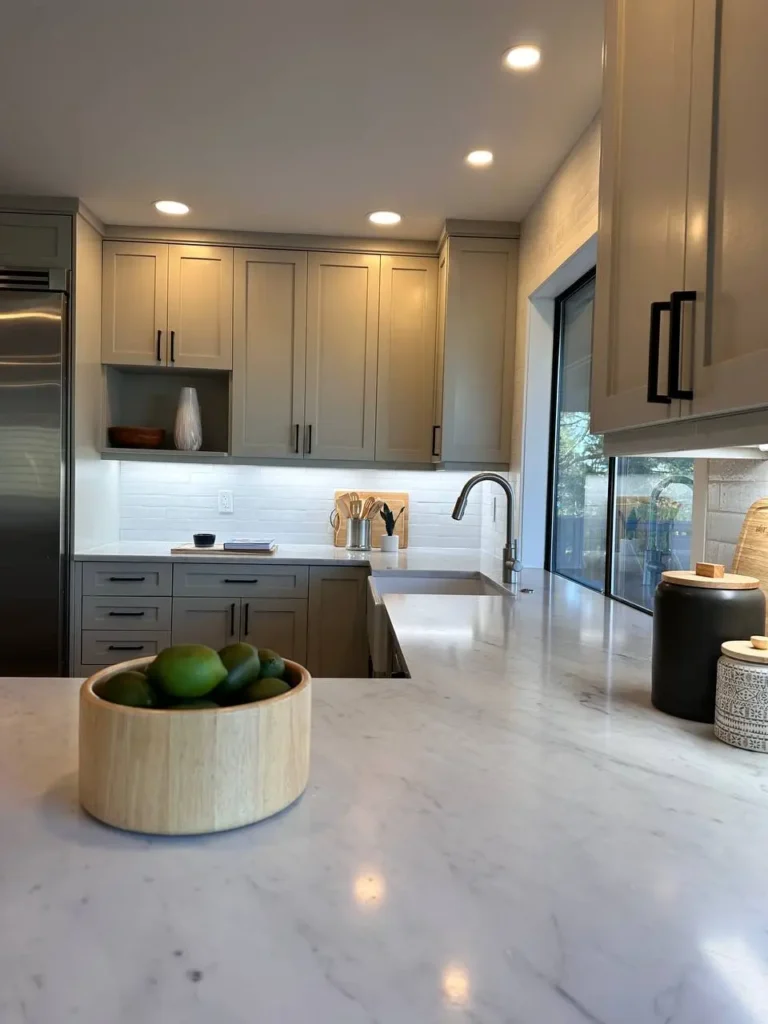 Modern Kitchen Remodel With White Overflow Countertops & Black Accents