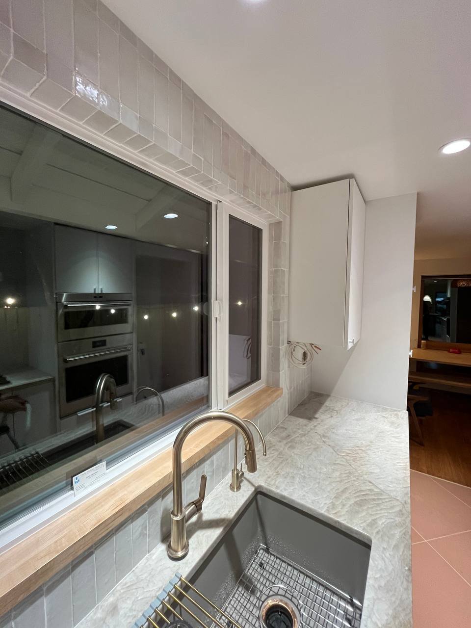 Modern Kitchen With Warm Wood And White Finishes Kitchen Remodel in Mercer Island, WA by FDC Construction project photo 5