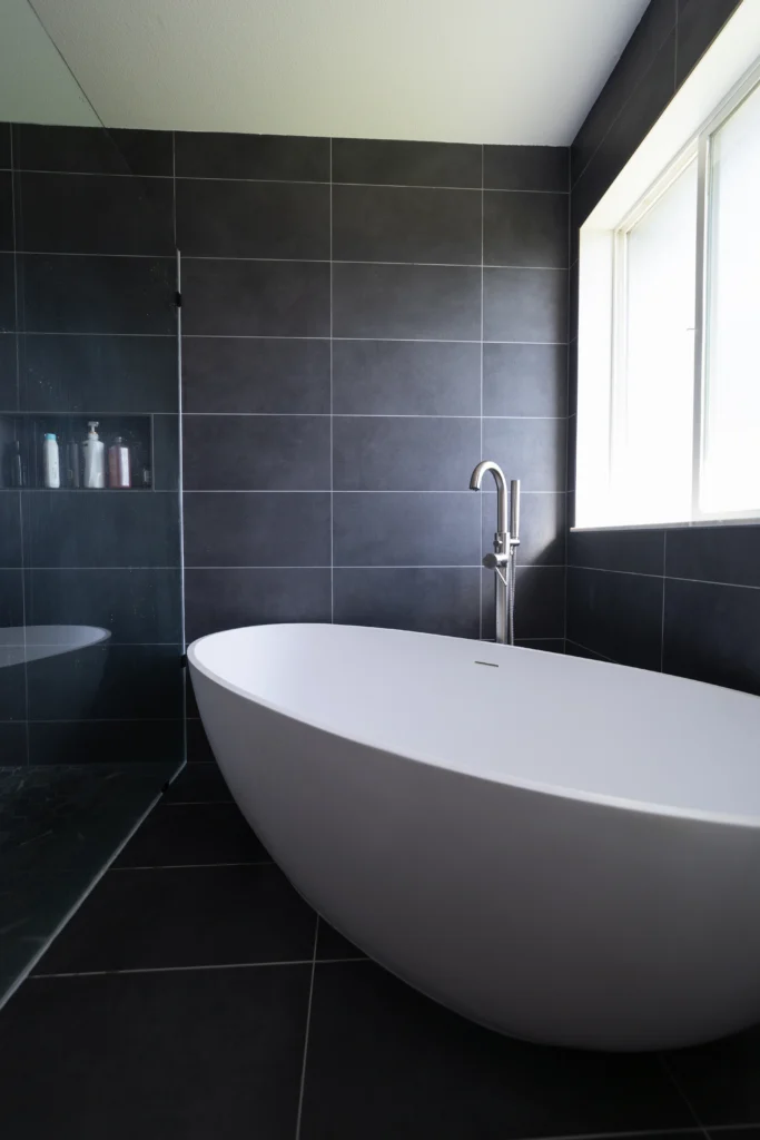 Modern Grey Bathroom With Large Tile & Standing White Tub