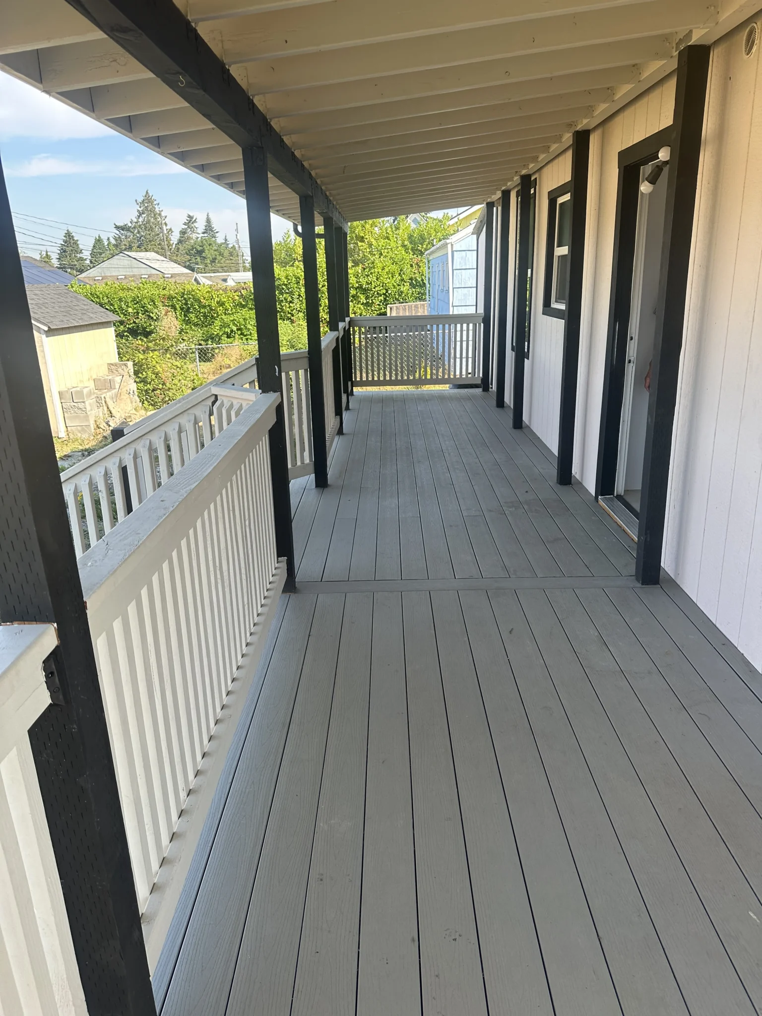 Wood Deck With White Fencing