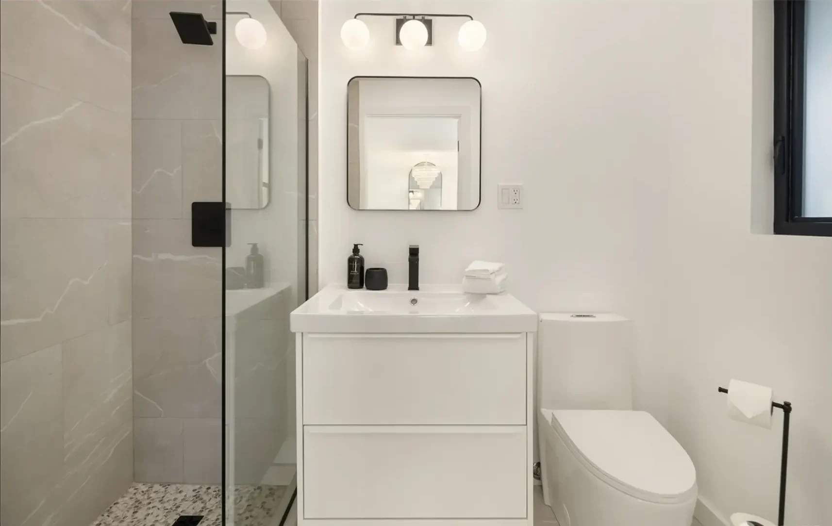 Modern White Bathroom Remodel With A Modern Toilet & Single Sink Vanity