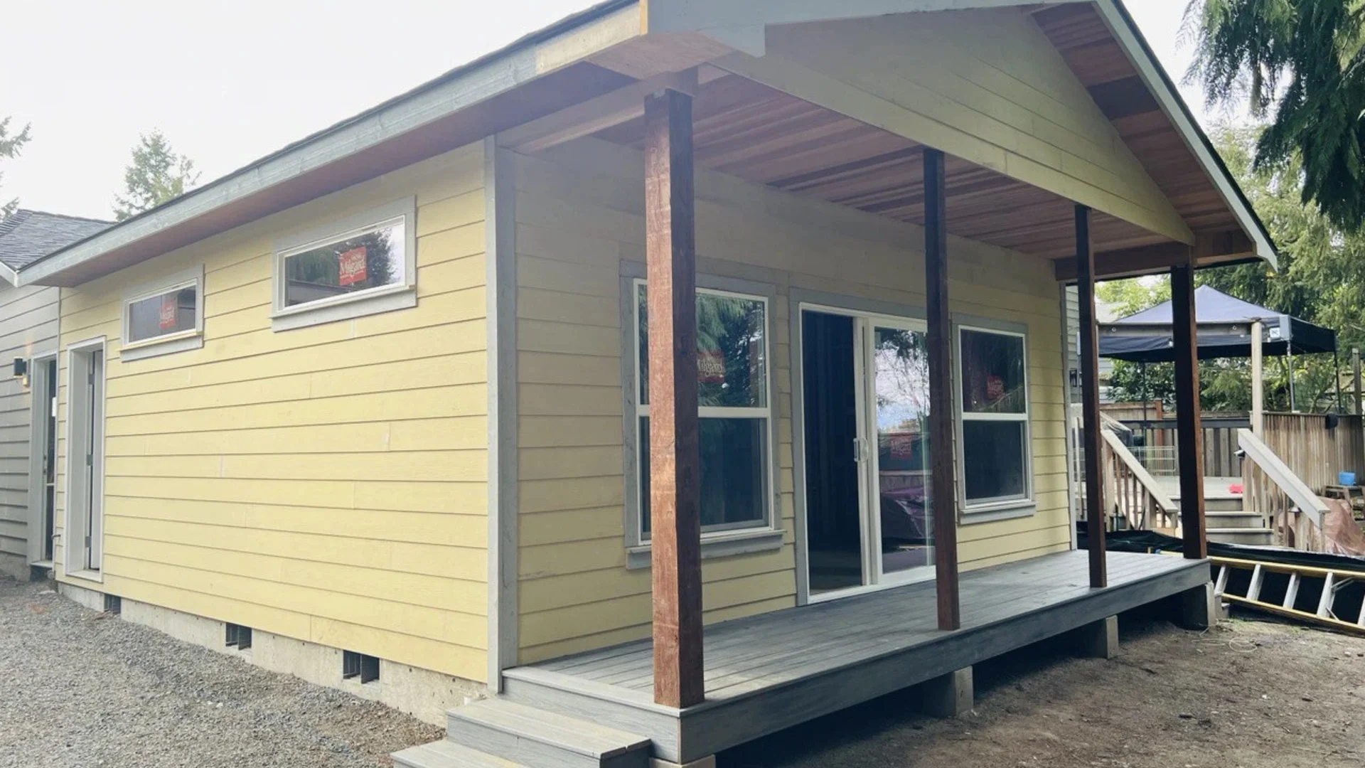 Yellow Home Addition Of Back Porch