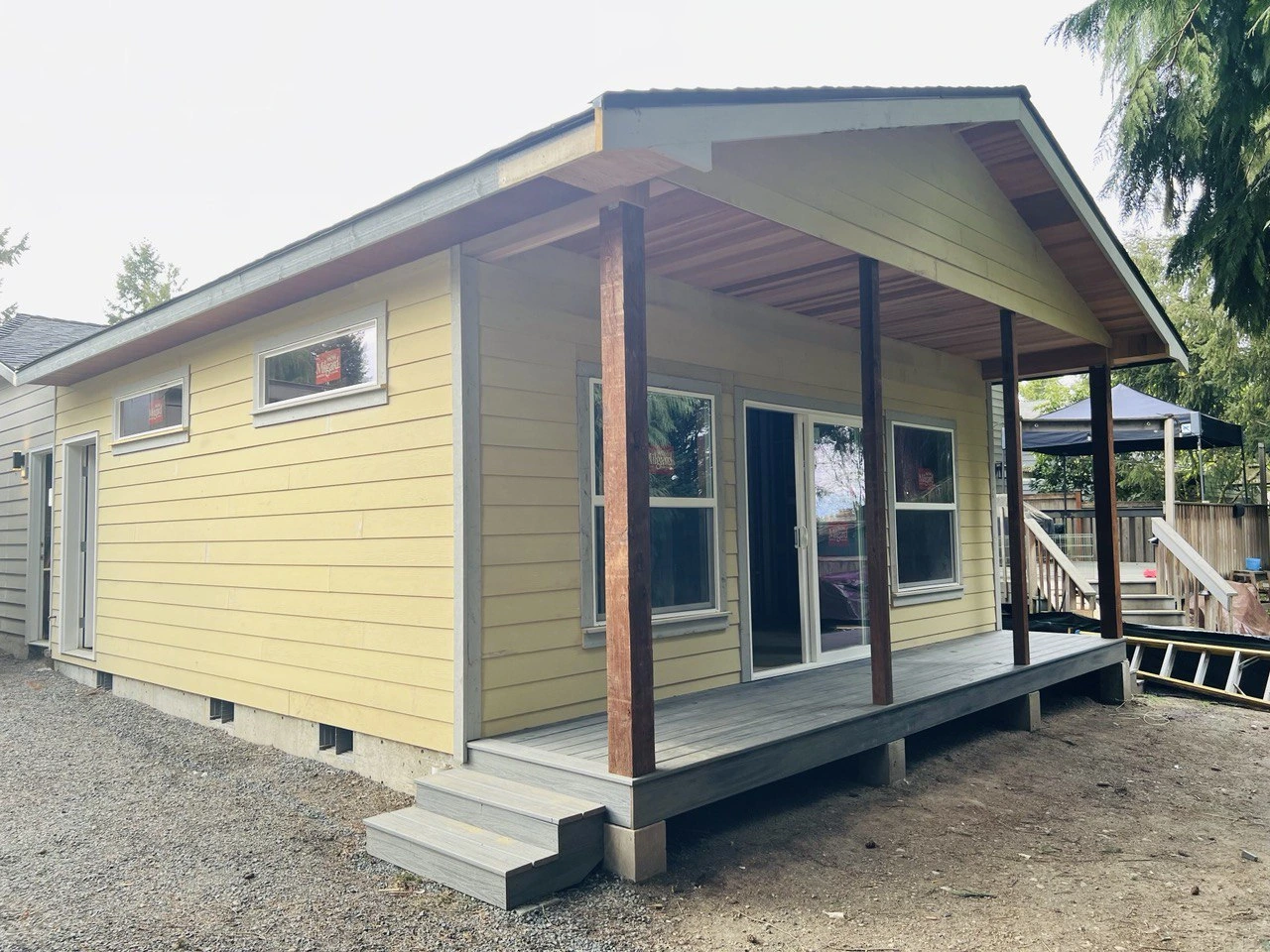 Yellow Home Addition Of Back Porch